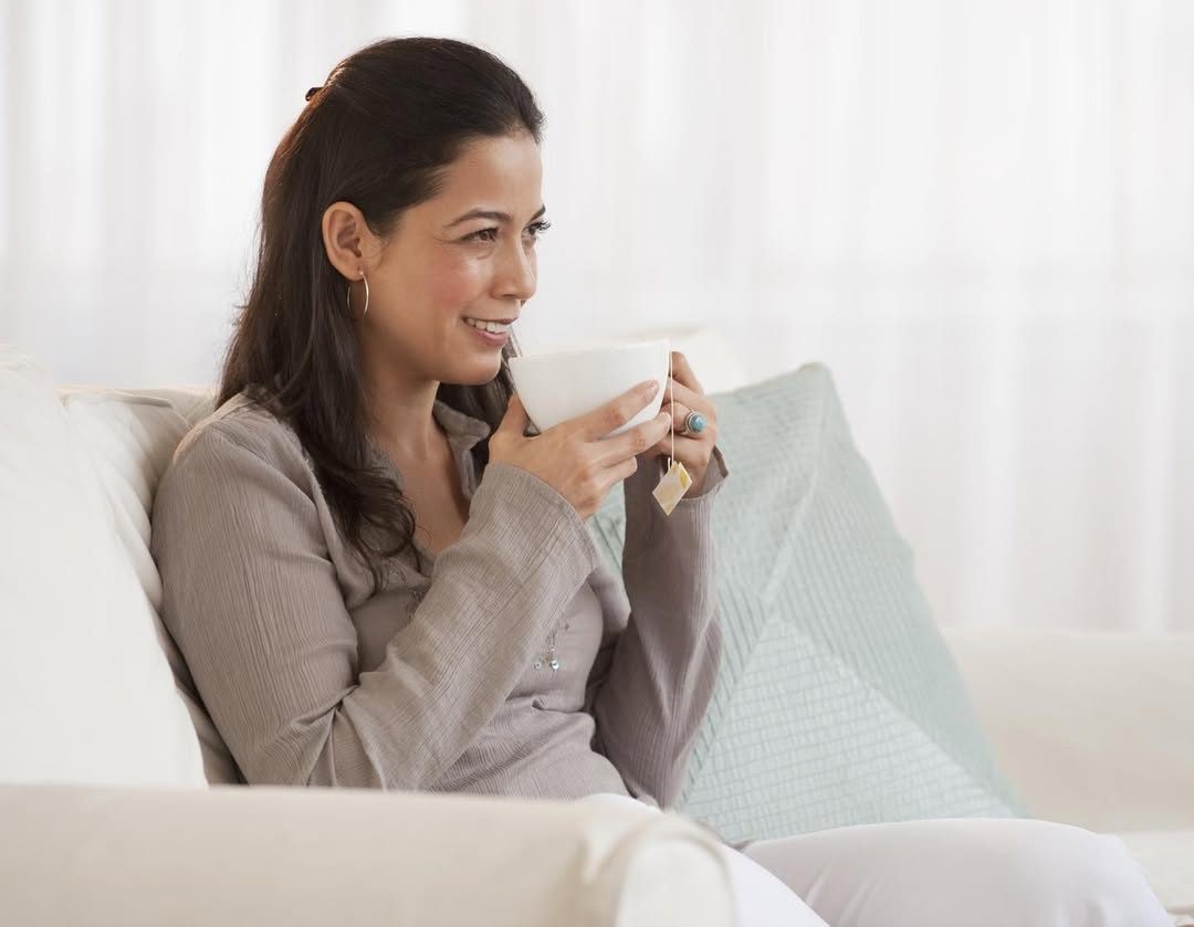 Gredivel Vasquez — lifestyle commercial still, enjoying tea at home