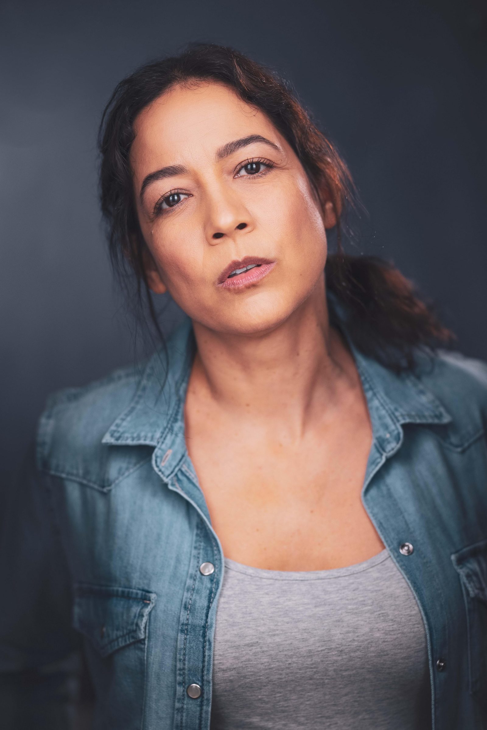 Gredivel Vasquez headshot — character, denim
