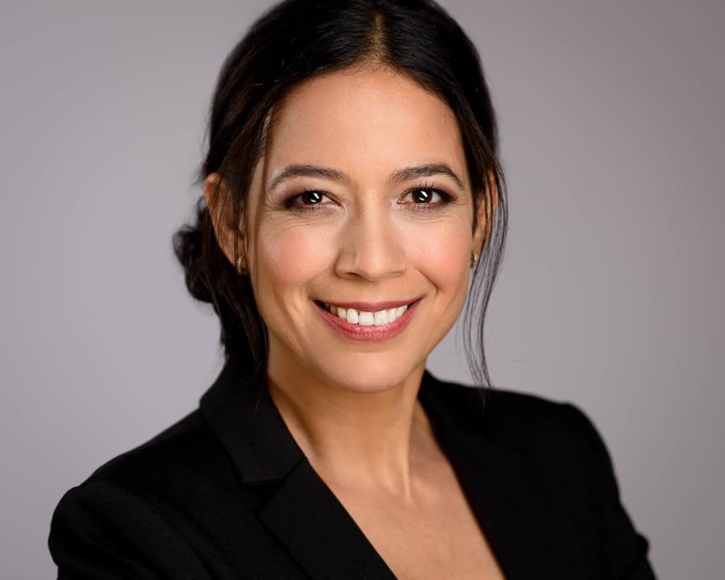 Gredivel Vasquez headshot — black blazer